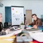 Business owner checking smart growth funding reviews online for authenticity